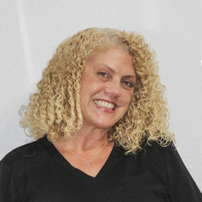 A headshot of Medorah, a staff member at Rawlinson Chiropractic.